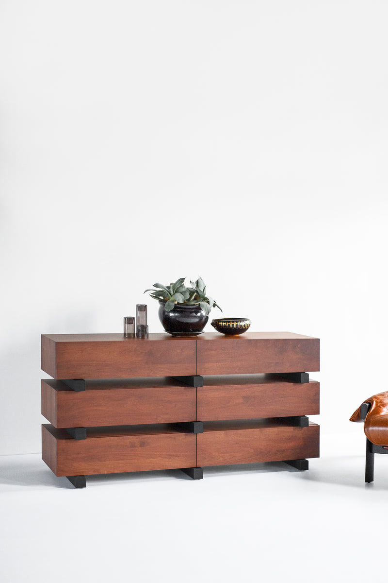 Detail of hand-cut dovetail joinery on a modern luxury walnut Santa Fe dresser drawer