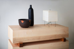 Side angle of a modern maple dresser highlighting its caramel wood tone