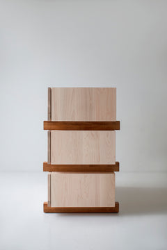 Close-up of the push-to-open drawers and dovetail joinery on a maple dresser