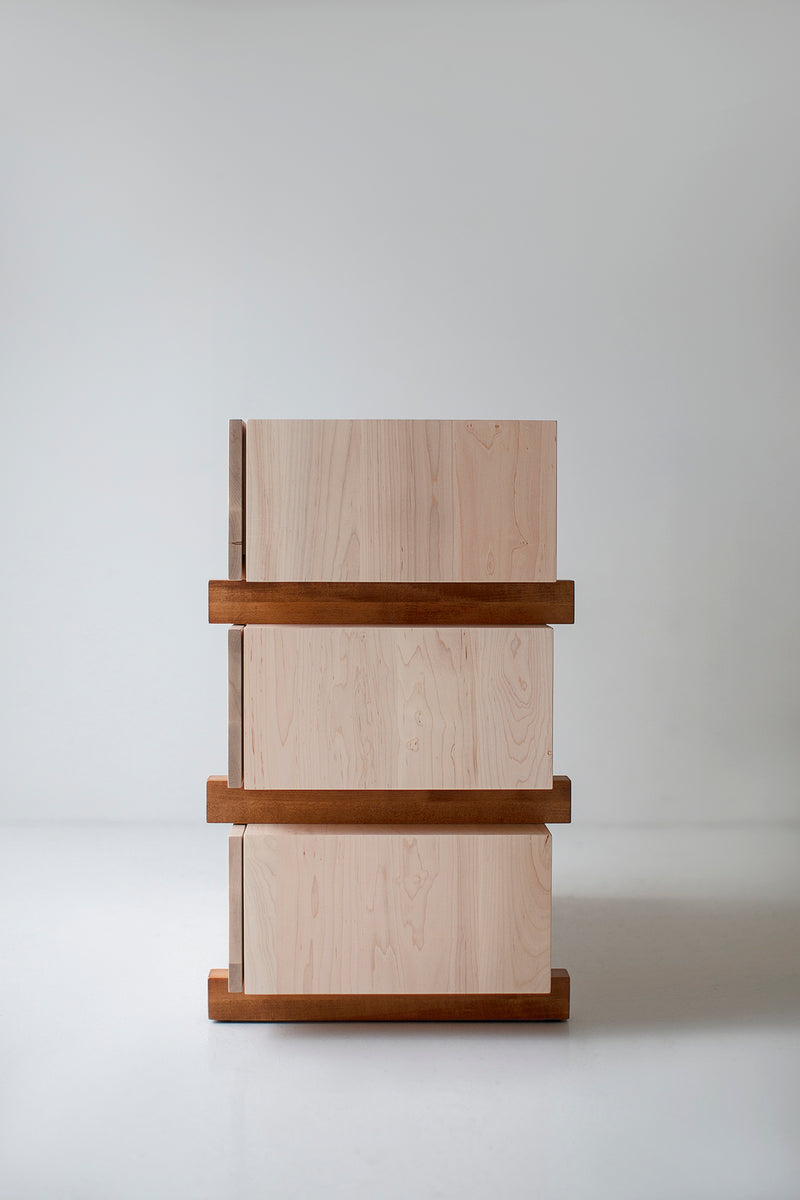 Close-up of the push-to-open drawers and dovetail joinery on a maple dresser