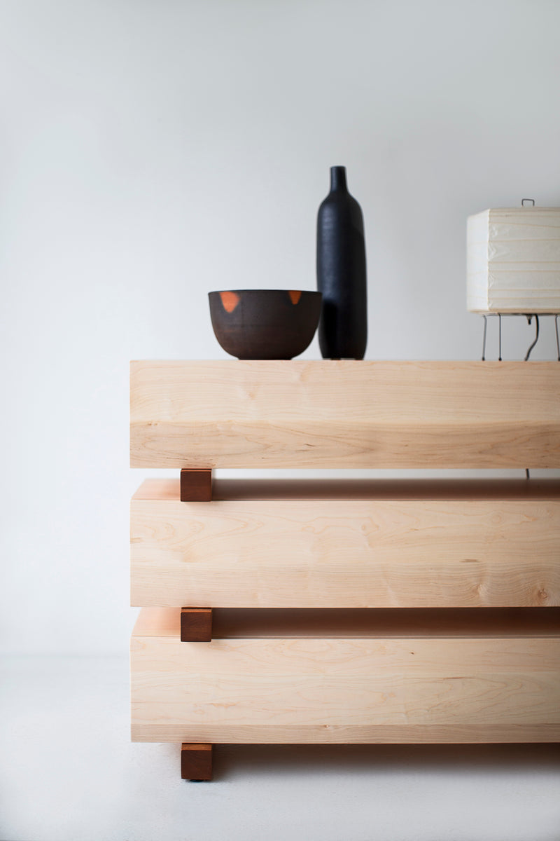 Full view of a Santa Fe maple dresser against a neutral wall