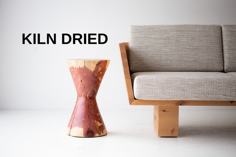 The Hourglass modern sculpted wood stump side table in natural red cedar, front view