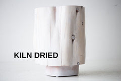 The Totem tall modern sculpted wood stump side table in natural red cedar, front view