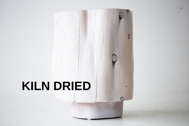 The Totem tall modern sculpted wood stump side table in natural red cedar, front view