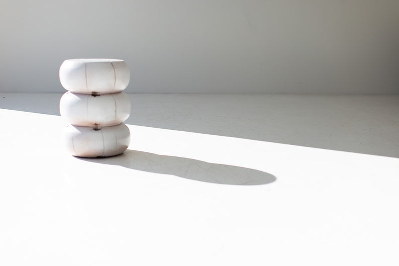 White end table styled as a nightstand