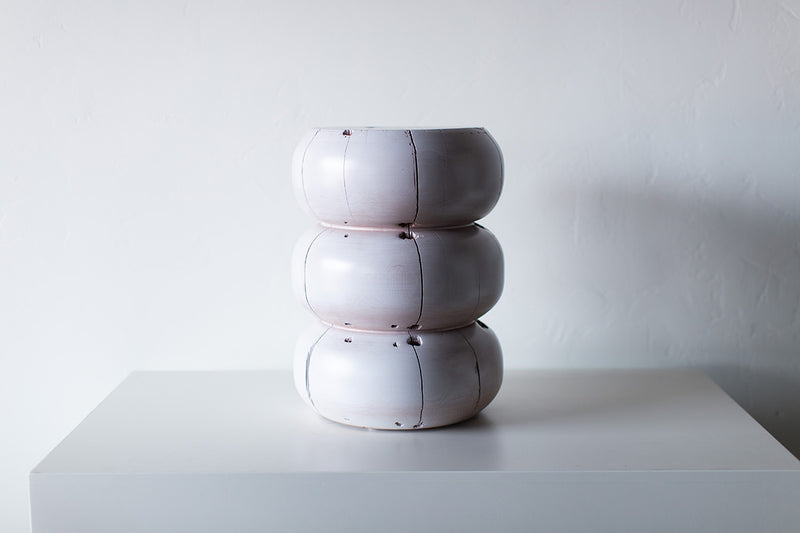 White end table styled in a bright interior