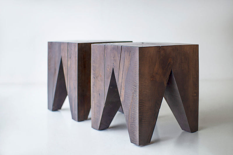 Side profile of a solid wood side table highlighting its organic silhouette