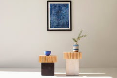 Side profile of a solid wood stump table highlighting its organic shape