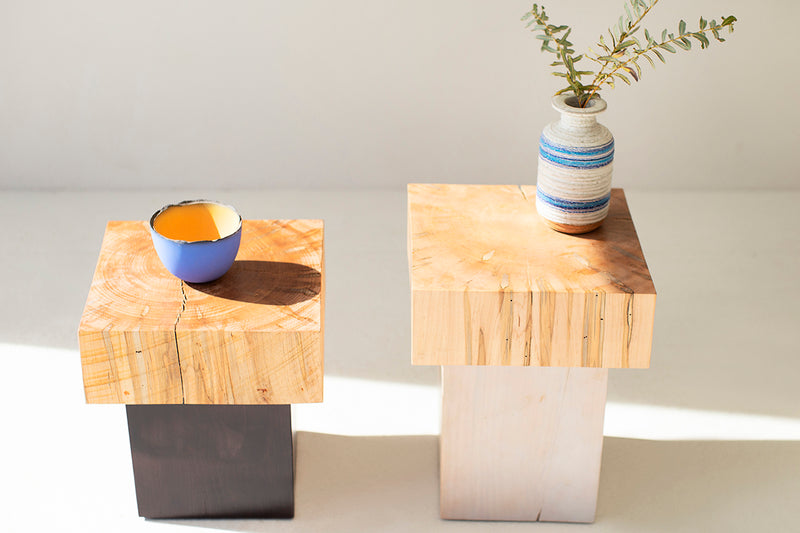 Angled view of a maple side table showing natural cracking and character