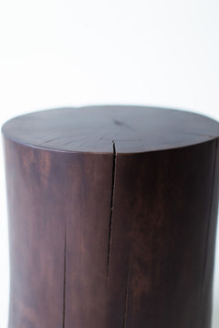 Three solid walnut stump tables grouped together at different heights