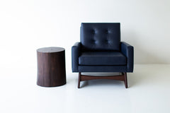 Full view of the solid walnut stump table against a neutral backdrop