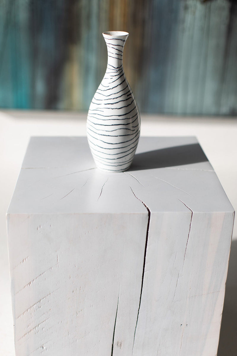 Whitewash maple block end table with a vase on top