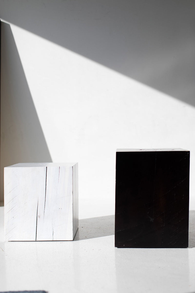 Whitewash and black maple block end tables in sunlight