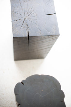 Side profile of the slate grey stump side table