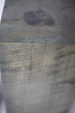 Square slate grey stump table shown up close