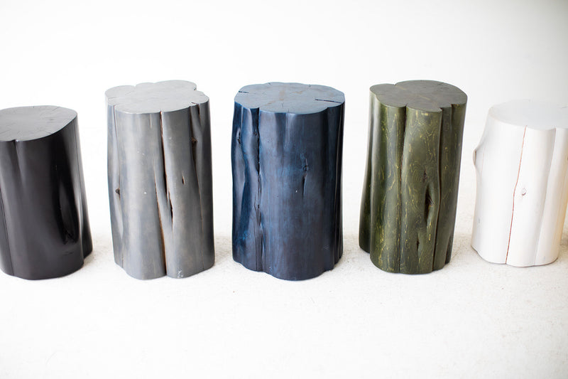 Stump side table styled beside a sofa