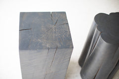 Pair of slate grey stump tables styled together