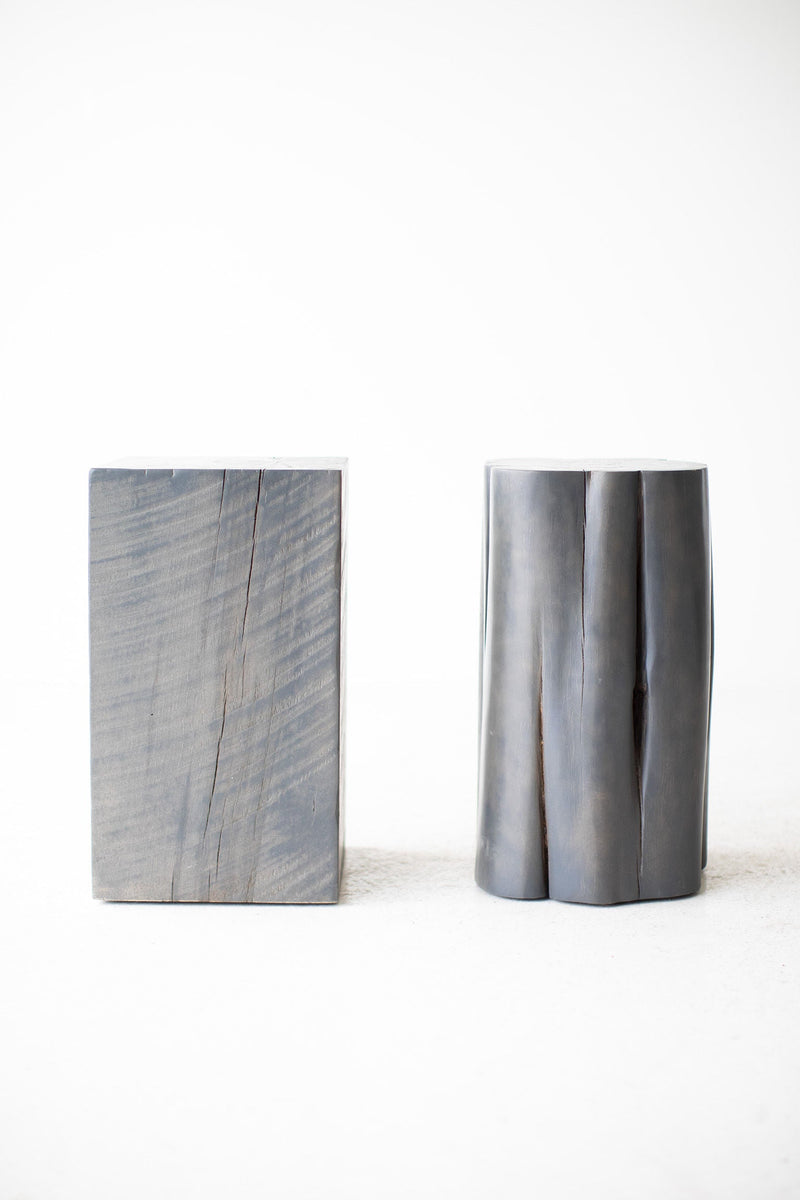 Slate grey square maple stump side table (left) beside a red cedar stump, Bertu Home