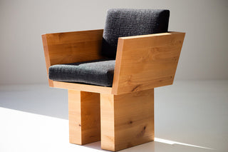 Modern wood dining arm chairs around a table
