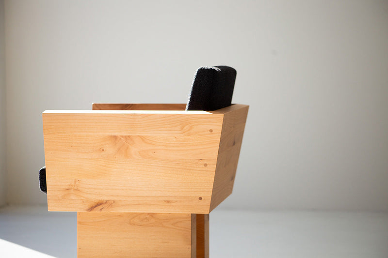 Organic modern alder dining chair in a dining room