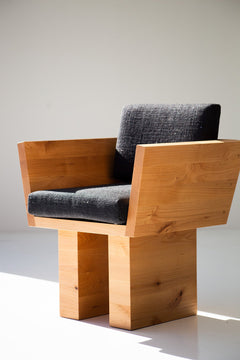 Modern wood dining arm chair in a bright dining space