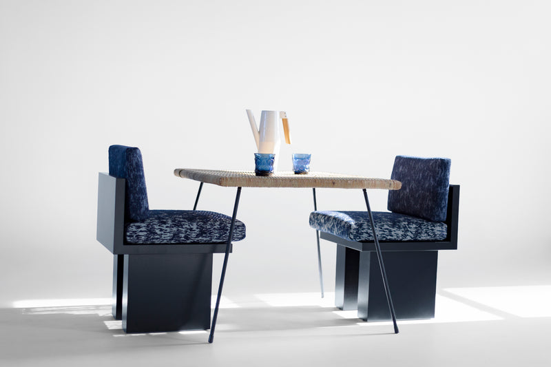 Side profile of an outdoor dining chair highlighting its straight back