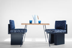Row of black Suelo outdoor dining chairs styled together