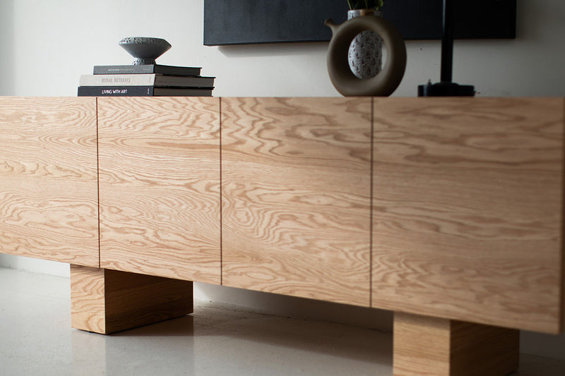 Close-up of the natural oak grain on the credenza doors