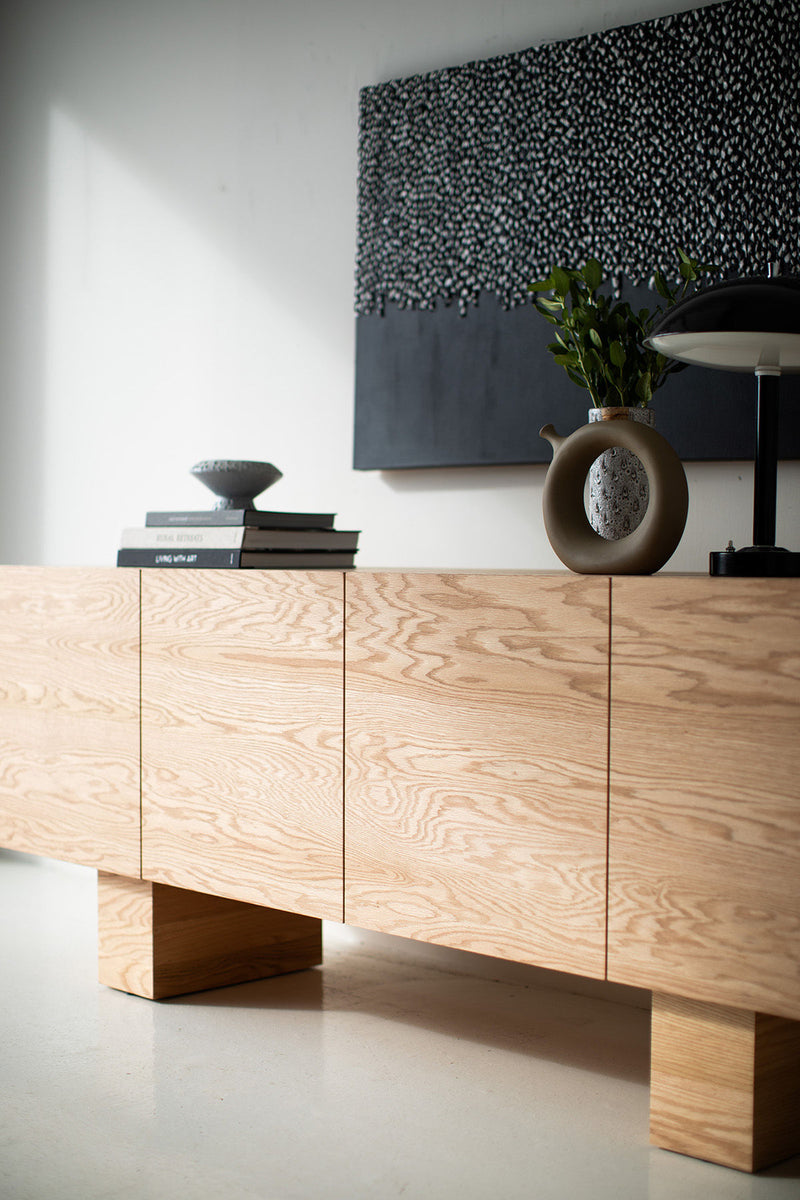 Three-quarter view of the credenza showing its matte finish
