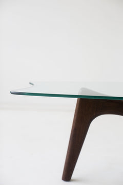 Close-up of the hand-shaped walnut legs on the Surf coffee table