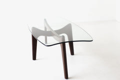 Angled view of the Surf walnut coffee table with glass top