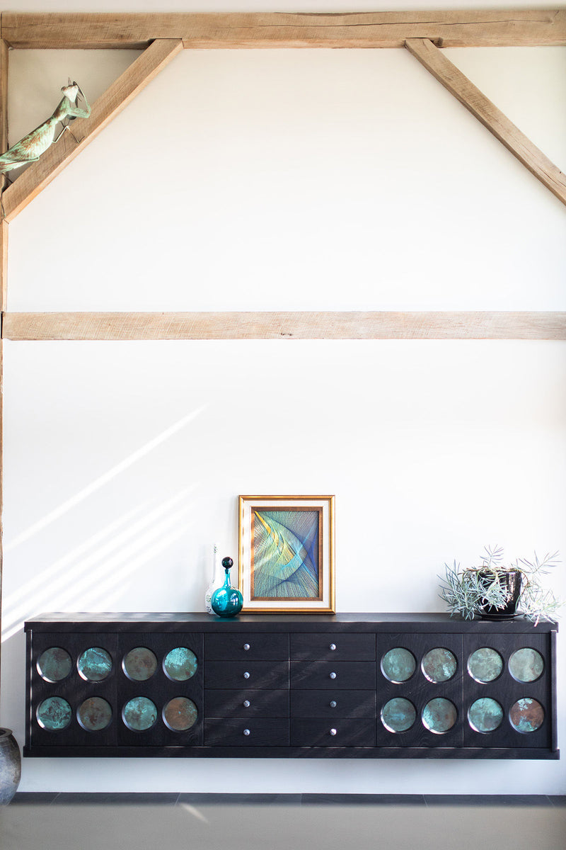 Full view of the oak credenza against a neutral backdrop