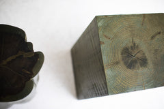 Stump side table styled beside a sofa