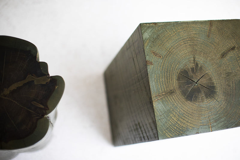 Stump side table styled beside a sofa