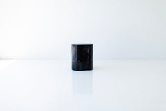 Tree stump table styled as a side table next to an armchair