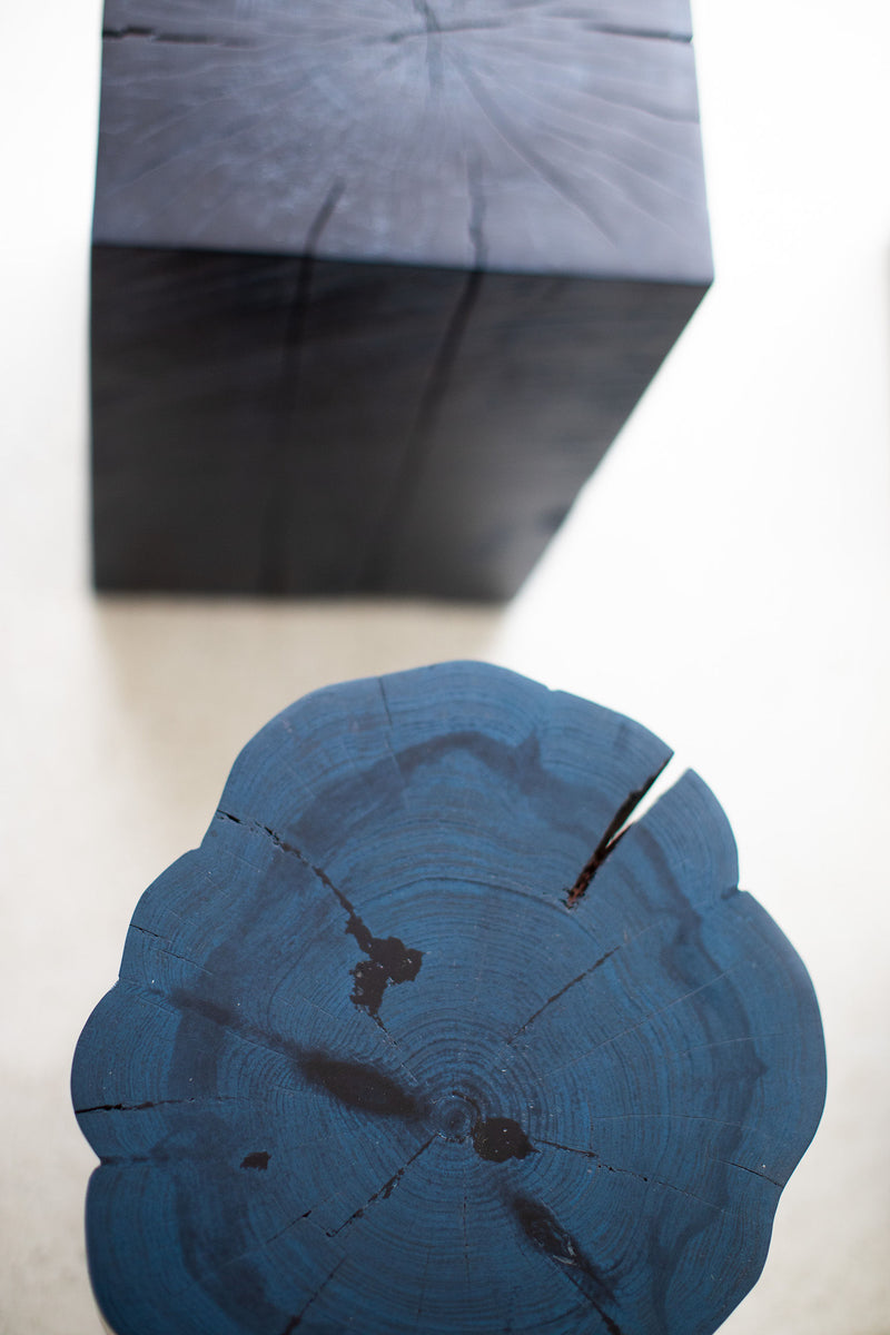Denim blue stump table styled as a side table