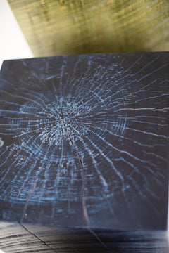 Square denim blue stump table shown up close