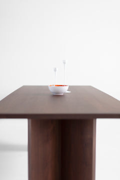 The Triad walnut table used as a desk in a modern home office