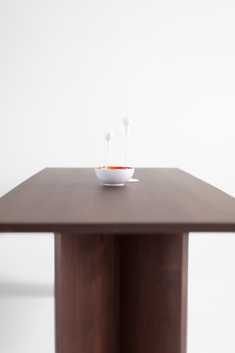 The Triad walnut table used as a desk in a modern home office