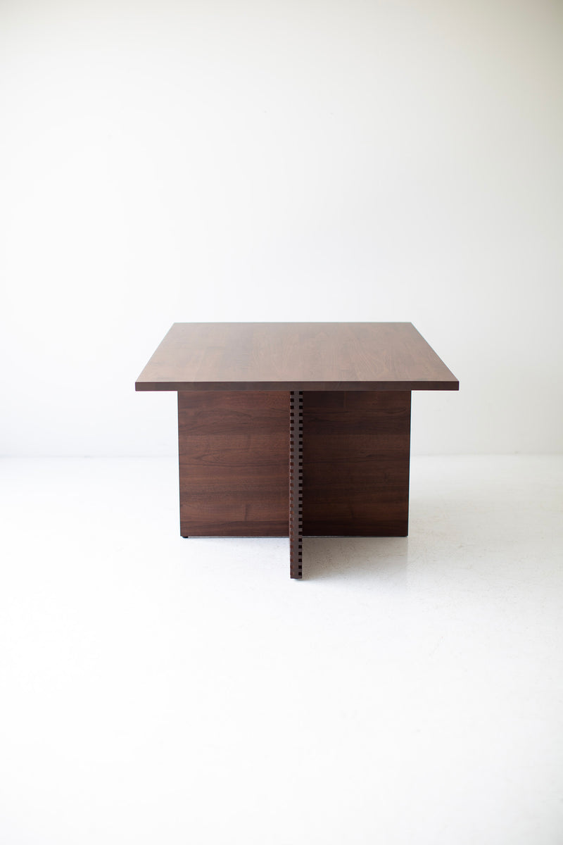 The Cicely modern walnut pedestal dining table styled with dining chairs