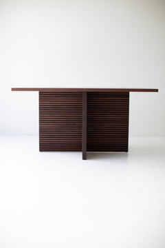 Full room view of the Cicely walnut pedestal dining table set for a meal