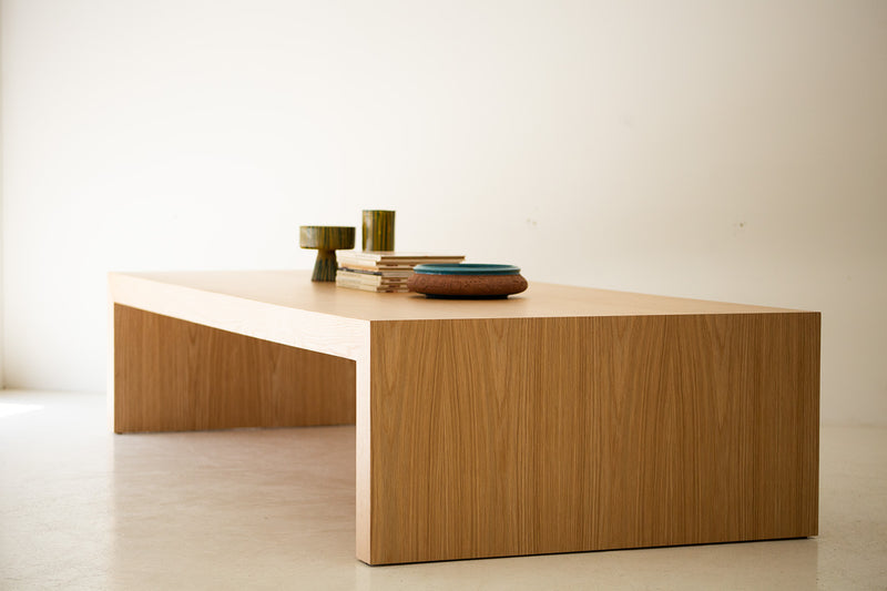 Waterfall coffee table styled in a bright living space