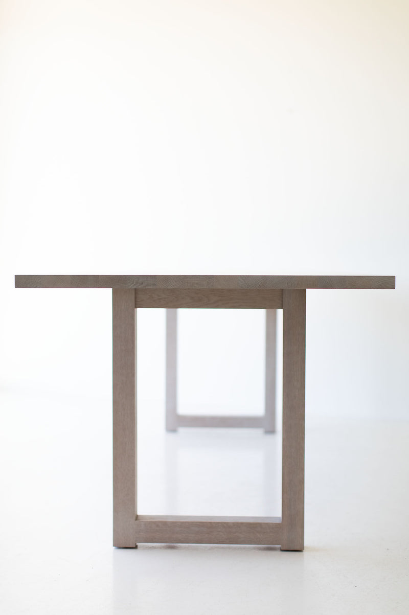 Close-up of the hand-applied whitewash finish on the modern oak tabletop