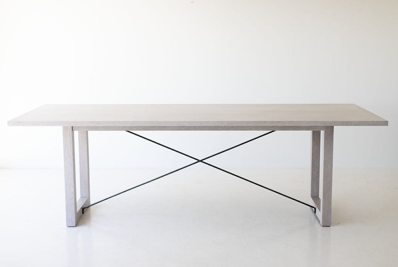 Close-up of the modern white oak table legs and base