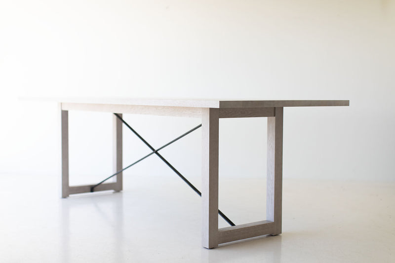 Modern whitewash white oak dining table styled in a modern dining space
