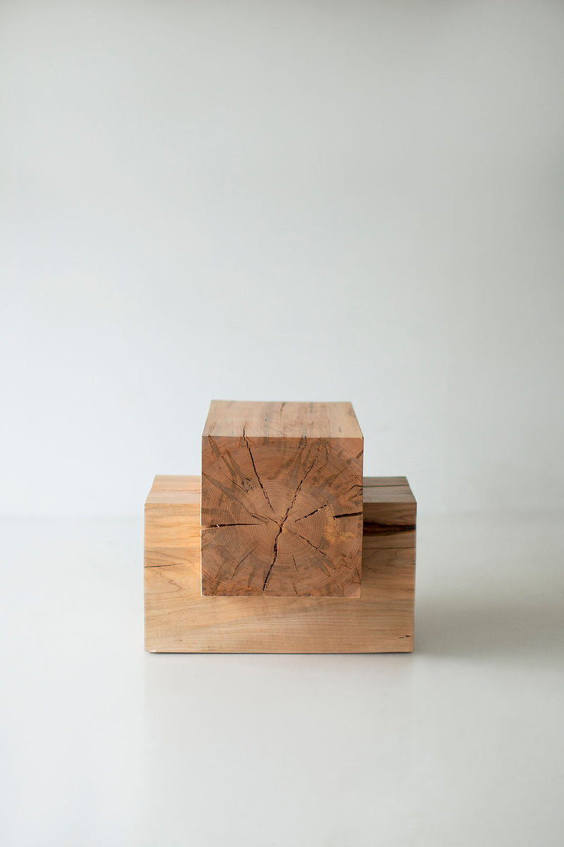 Full view of a wood beam end table against a white backdrop