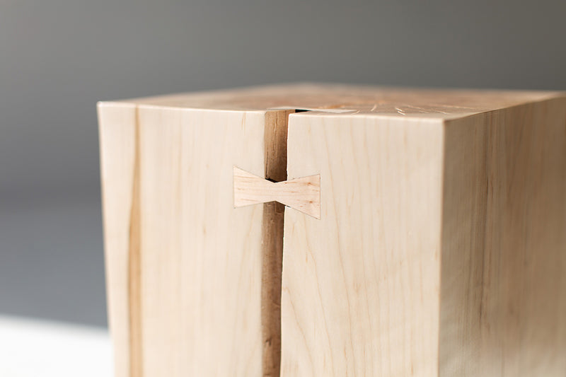 Close-up of the bowtie joinery detail on the wood side table