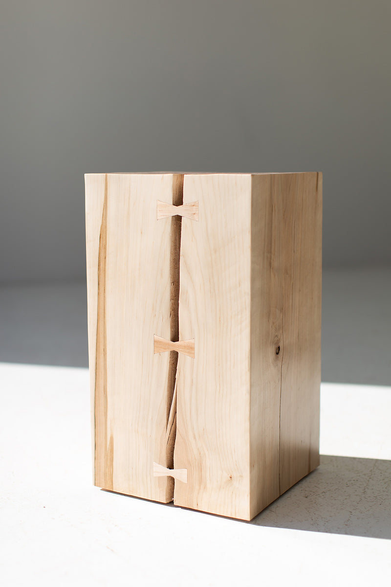 Detail shot of the natural cracking and bowtie reinforcement on the side table