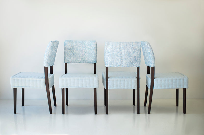 Overhead view of a quilted dining chair seat showing the stitched pattern