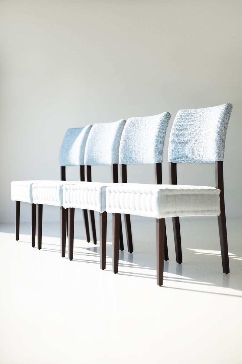 Close-up of the oak leg joinery on a hand-stitched quilted dining chair